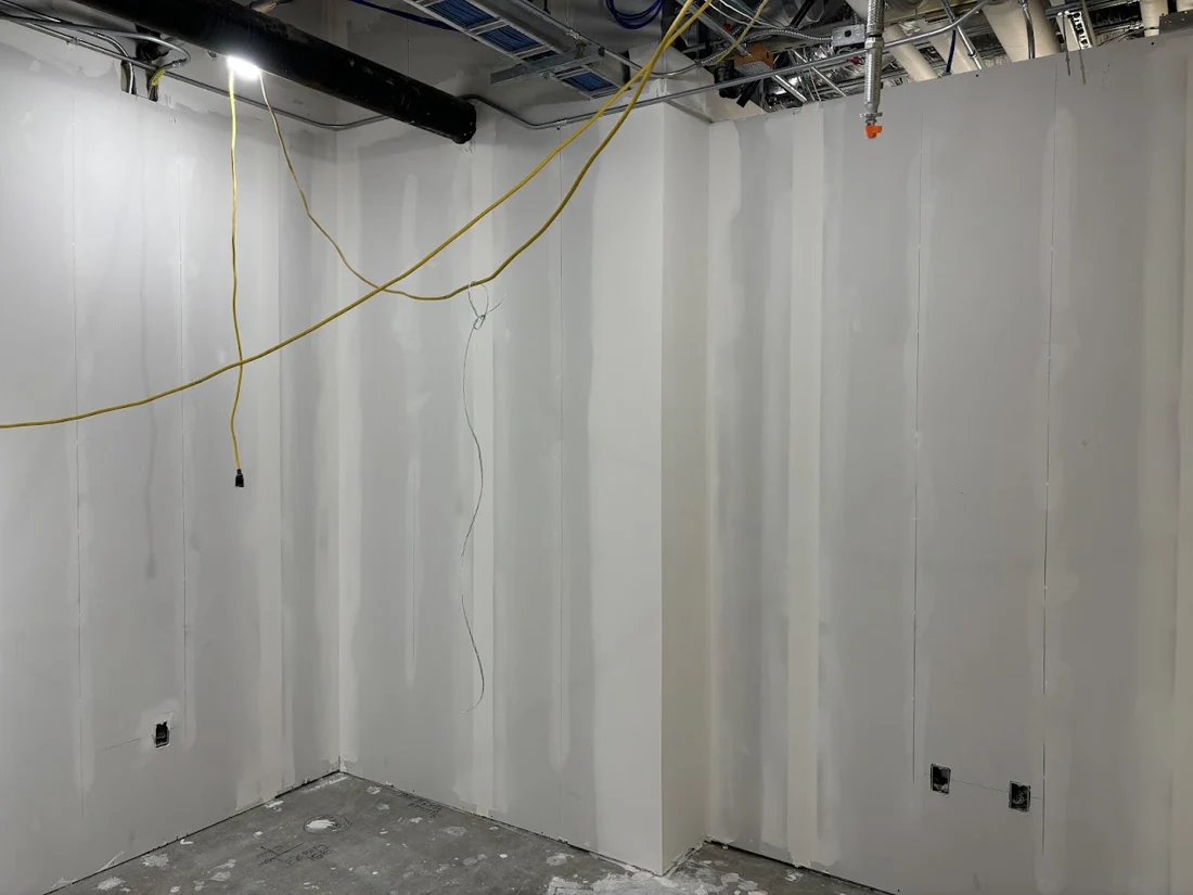 Joint finishing in a commercial work area.