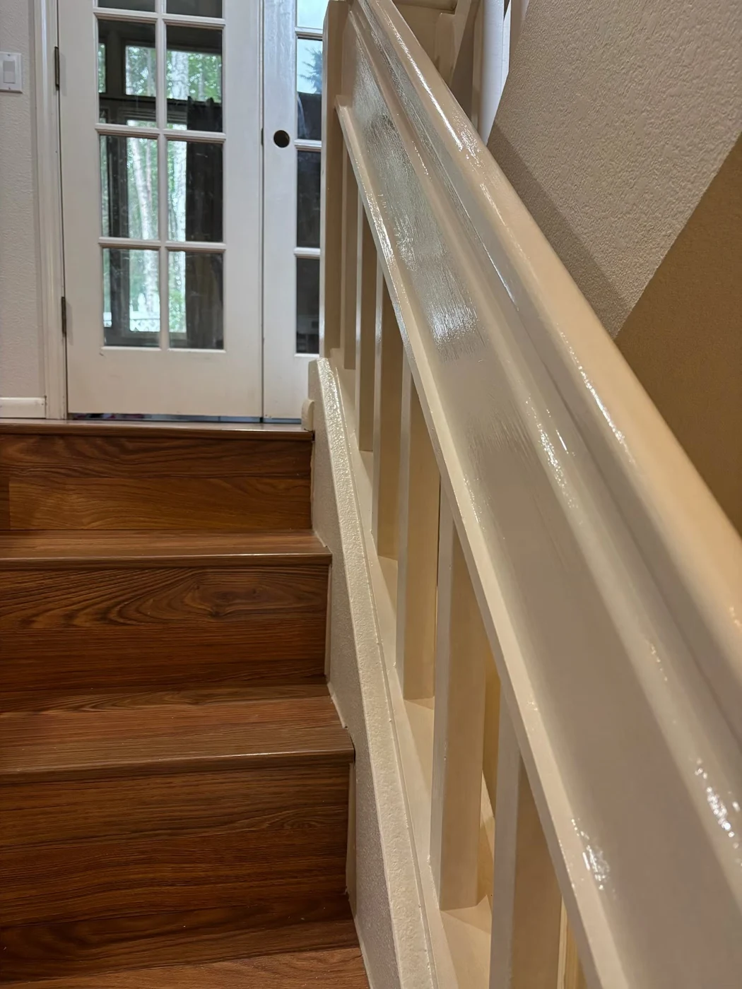 A close view of painted railing, trim and wall surfaces.